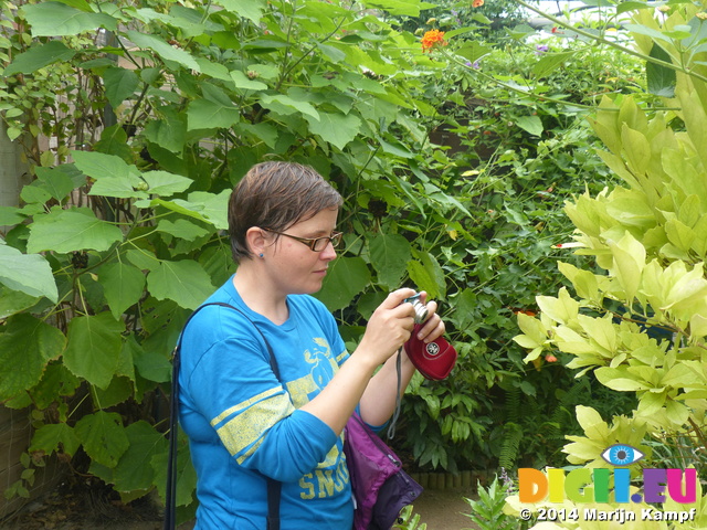 FZ007357 Jenni photographing butterfly